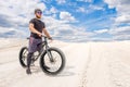 Training a bicyclist in a chalky quarry. A brutal man on a fat bike.