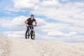 Training a bicyclist in a chalky quarry. A brutal man on a fat bike.