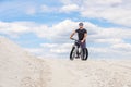 Training a bicyclist in a chalky quarry. A brutal man on a fat bike.