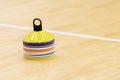 Training cones on hardwood court floor. Basketball, futsal, handball and volleyball practice. Game equipment Horizontal sport them Royalty Free Stock Photo