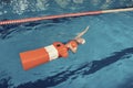 Training Dummy and a Girl in a Pool Water Rescue Lesson Royalty Free Stock Photo