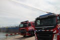 Training with extinguish water jets by the fire brigade in harbor 6100 in the port of Rotterdam in the Netherlands.