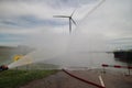 Training with extinguish water jets by the fire brigade in harbor 6100. Royalty Free Stock Photo