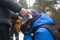 Training in first aid for eye injury. Reportage from a place in the winter forest where the exercises are taking place Royalty Free Stock Photo
