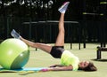 Training on the fit ball. Young woman doing sports exercises on a ball for training Royalty Free Stock Photo