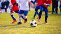 Training and football match between youth teams. Young boys playing football match Royalty Free Stock Photo
