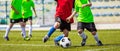 Training and football match between youth teams. Young boys playing football Royalty Free Stock Photo