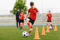 Training football session for children on soccer camp. Boy in children`s soccer team on training