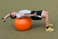 Training with handles and gymnastic ball Royalty Free Stock Photo