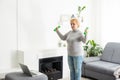 Training At Home. Sporty senior woman doing yoga plank while watching online tutorial on laptop, exercising in living Royalty Free Stock Photo