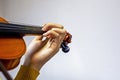 training the left hand on the strings on the student's violin. Musical education Royalty Free Stock Photo