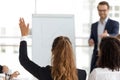 Training participant raise hand ask question at employees team workshop Royalty Free Stock Photo