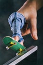 Training process of riding a fingerboard on a ramp