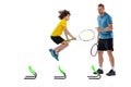 Training. Professional tennis player, coach teaches teen to play tennis isolated over white studio background. Concept Royalty Free Stock Photo