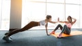 Training together. Girls doing abs workout and plank Royalty Free Stock Photo