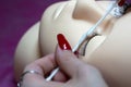 Training a young master to build eyelashes on a silicone mannequin. Work with tweezers, volume shaping, correction, care and remov