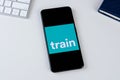 Trainline app logo on a smartphone screen.