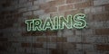 TRAINS - Glowing Neon Sign on stonework wall - 3D rendered royalty free stock illustration