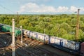 Trains on the railway with the factory in the background. Shooting from height