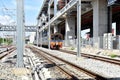 The Trains running on the train tracks to the station in Thailand