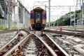 The Trains running on the train tracks to the station in Thailand