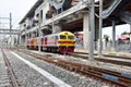 The Trains running on the train tracks to the station in Thailand