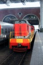 Trains at the train station waiting for passengers to board. Travel by rail on vacation