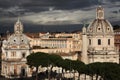 Trajan Column and Baroque churches in Rome, Italy.