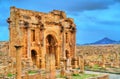 Trajan Arch within the ruins of Timgad in Algeria. Royalty Free Stock Photo