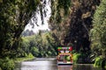 Trajinera sailing alone along the Xochimilco River Royalty Free Stock Photo