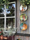 Painting couple lover artwork on ceramic plates decorating shop walls on the lakefront around the Trakai Island Castle in Trakai,