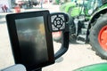 Traktor cabin device. Inside modern tractor. Control panel with buttons, monitor, Steering wheel. View from work place
