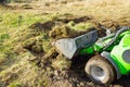 Traktor on the field. Mini traktor landscaping at home backyard