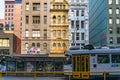 Tram arriving on tram stop on Elizabeth street in Melbourne CBD