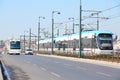 Tram, bus and car at sunny summer day