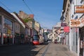 Tram car traveling on a clear shopping street in Bratislava, Slovakia