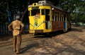 The tram driver stands in front of the tram at kolkata