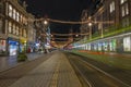 Tram driving on Damrak in christmas time in Amsterdam Netherlands Royalty Free Stock Photo