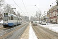 Tram driving in snowy Amsterdam Netherlands Royalty Free Stock Photo