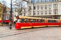 Tram and dutch traditional houses on background in Hague