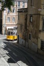 Tram 28 : the famous yellow tram 28 passing on street in Lisbon, Portugal Royalty Free Stock Photo