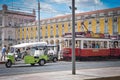 Tram in Lisbon and neoclassical architecture.