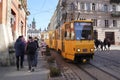 Tram of Lviv public transport in ancient city center near market square Beautiful yellow tram historic center of Lviv Ukrainian