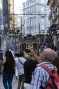 Tram and man taking a photo in Santa Catarina street Porto