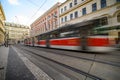 Tram with motion blur through cobbled streets of old town district of Prague Royalty Free Stock Photo