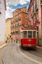 Tram on narrow street of Alfama, Lisbon