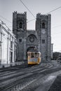 Tram 28 in the old town of Alfama in front of the Cathedral. Mediterranean, Lisbon, Portugal