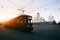 Tram passing Helsinki Senate Square during sunset with Helsinki Royalty Free Stock Photo