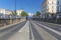 Tram passing under the bridge Royalty Free Stock Photo