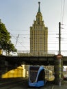 Tram passing under Kalanchevsky viaduct with view of Leningradskaya hotel.